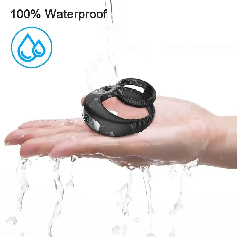 Black dual-ring vibrator shown under running water