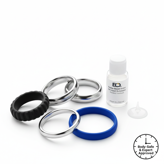 Silver cock rings and a small bottle on a white background