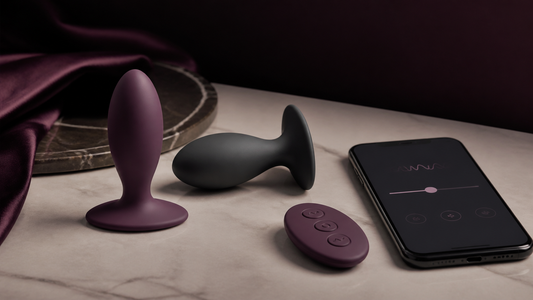 Remote butt plugs with handheld remote and App control