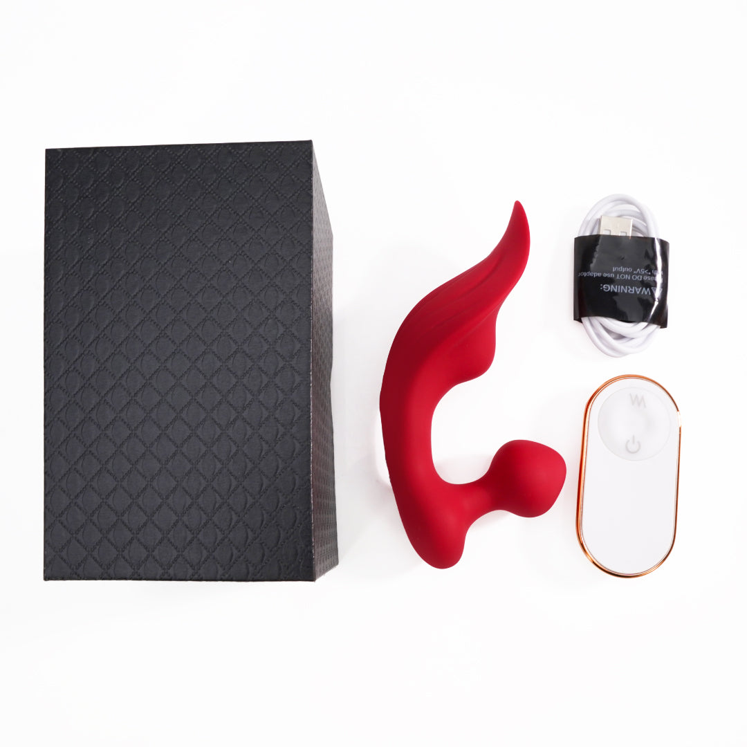 Red Chomper-RCT rechargeable clitoral vibrator set with remote and charging cable.
