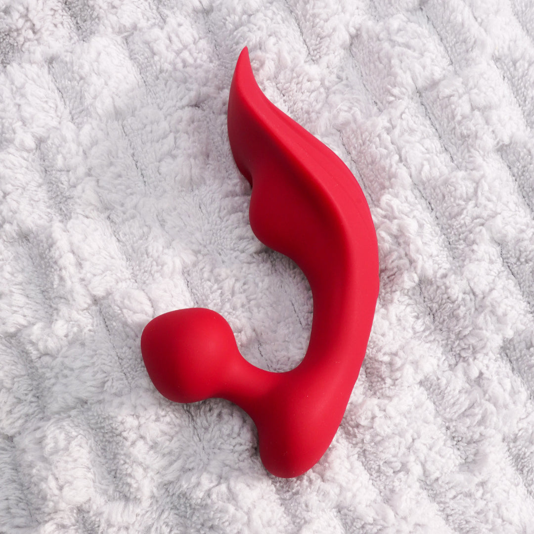 Chomper-RCT rechargeable vibrator, red silicone, curved ergonomic shape.